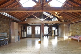 First Option Studio - floor - wooden,exposed brick,floor - light