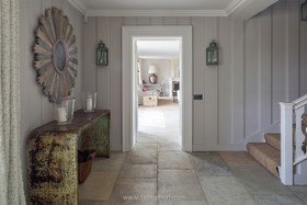 Limestone - wood panneling,floor - tiled,staircase,hallway