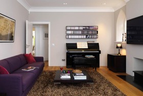 Phillips Place - living room,floor - wooden,piano,floor - dark,modern