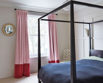 The modern four poster bed in the main bedroom