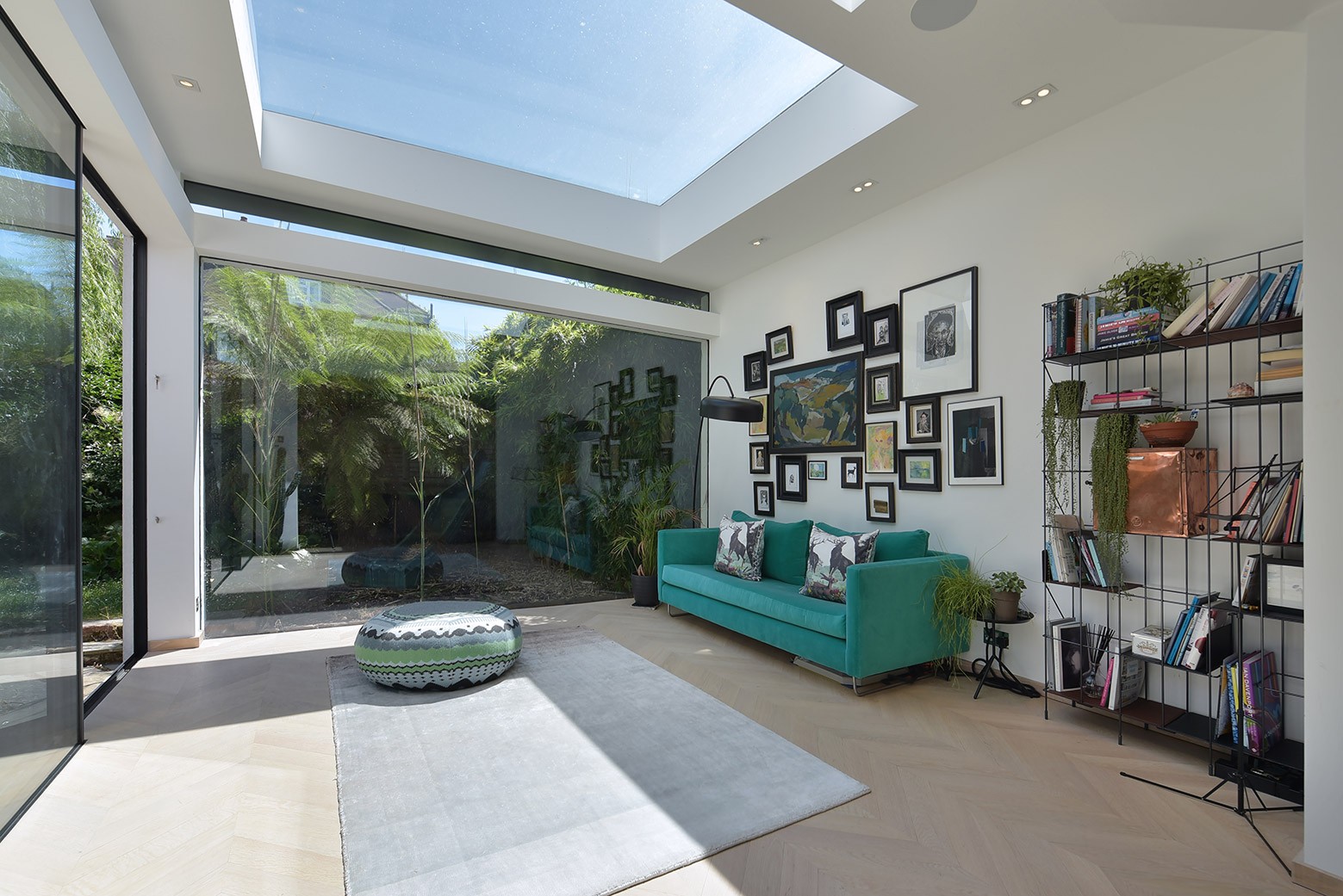 The glass-walled living room bringing the garden in